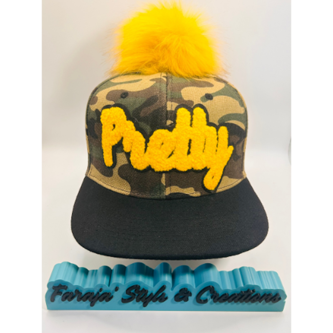 Camo Snapback Hat with Golden Yellow Chenille “Pretty” Patch & Pom Pom Ball | Pretty Girl Collection